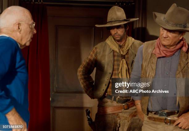 Howard Hawks, George Plimpton, John Wayne, behind the scenes of the making of 'Rio Lobo', for the Disney General Entertainment Content via Getty...