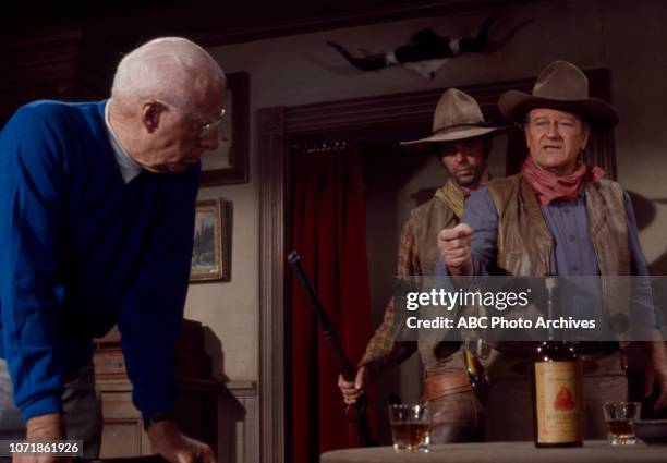 Howard Hawks, George Plimpton, John Wayne, behind the scenes of the making of 'Rio Lobo', for the Disney General Entertainment Content via Getty...