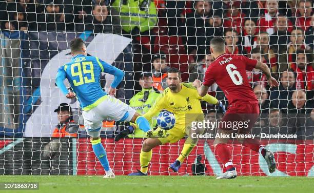 Alisson Becker of Liverpool makes a save from Arkadiusz Milik of SSC Napoli during the UEFA Champions League Group C match between Liverpool and SSC...