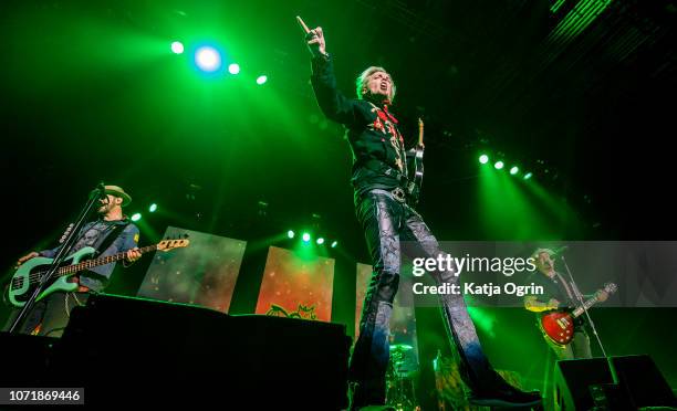 Ben Wells, Chris Robertson and Jon Lawhon of Black Stone Cherry perform on stage at Arena Birmingham on December 11, 2018 in Birmingham, England.