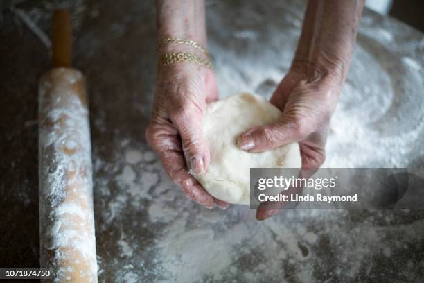 senior woman cooking pie - hand pastry stock pictures, royalty-free photos & images