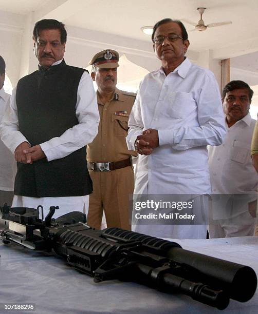 Union Home Minister P Chidambaram and {R} Maharashtra Chief minister Prithviraj Chavan during the weapon exhibition at Police gymkhana in Mumbai on...