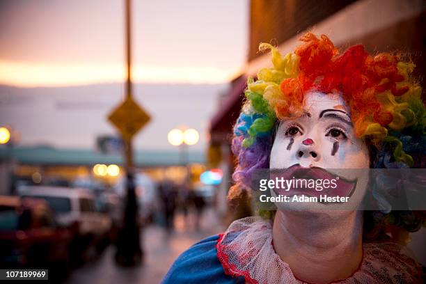 a young girl dressed up as a clown. - joker stock pictures, royalty-free photos & images