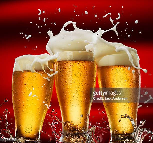three beer glasses - beer splashing stock pictures, royalty-free photos & images