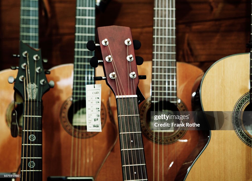 Different classic guitars in a shop