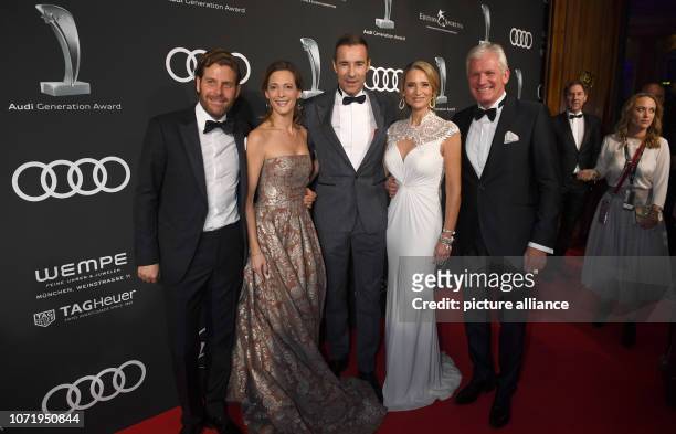 December 2018, Bavaria, München: Event manager Philip Greffenius and his wife Evelyn, presenter Kai Pflaume and Alexander Schuhmacher and his wife...
