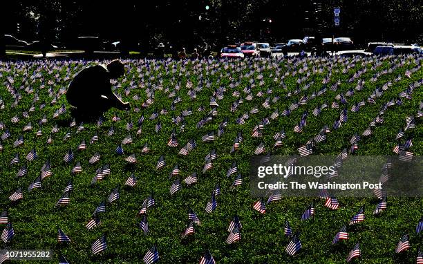 American flags have been planted on a grassy area of the Mall, each of them represents a veteran or a service member who died by suicide in 2018 so...