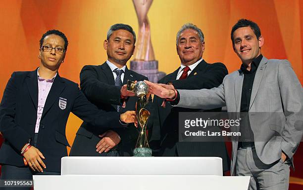 The head coaches from group B Hope Powell of England, Norio Sasaki of Japan, Leanardo Cuellar of Mexico and John Herdman of New Zealand pose with the...