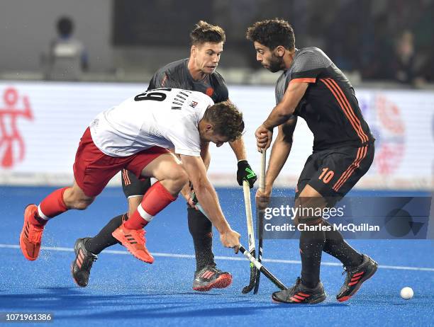 Mark Pearson of Canada is challenged by Valentin Verga of the Netherlands during the FIH Men's Hockey World Cup Cross-over match between Netherlands...