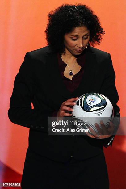 Steffi Jones, head of the Local Organising Committee, looks at the official ball 'Speedcell' during the offical FIFA 2011 Women 's World Cup final...