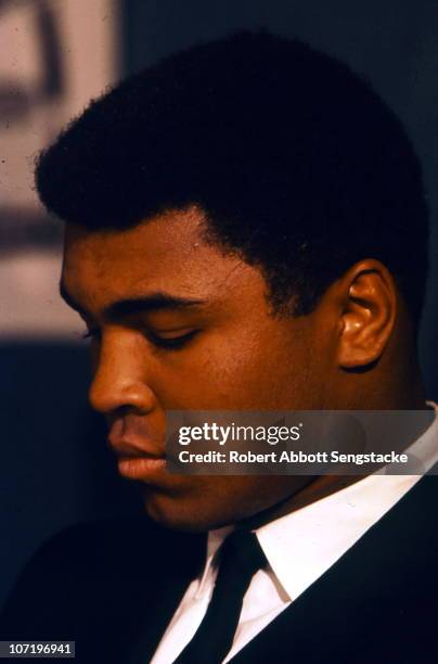 Close-up portrait of a pensive Muhammad Ali , taken during his visit to Harlem, on the same day as a promotional event touting his upcoming fight...