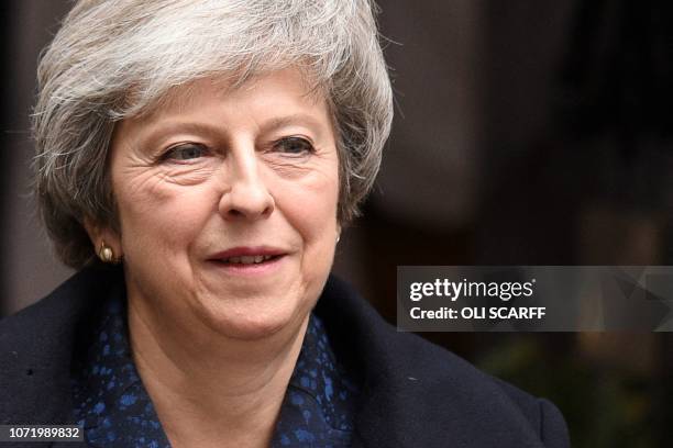 Britain's Prime Minister Theresa May leaves 10 Downing Street in central London on December 12, 2018 ahead of the weekly question and answer session,...