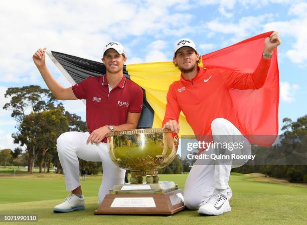 Thomas Detry and Thomas Pieters of Belgium pose with the trophy after winning during day four of the 2018 World Cup of Golf at The Metropolitan on...