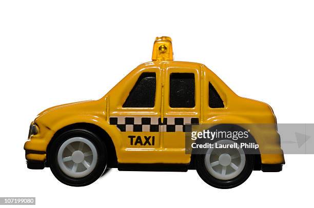 toy taxi against white background - yellow taxi ストックフォトと画像