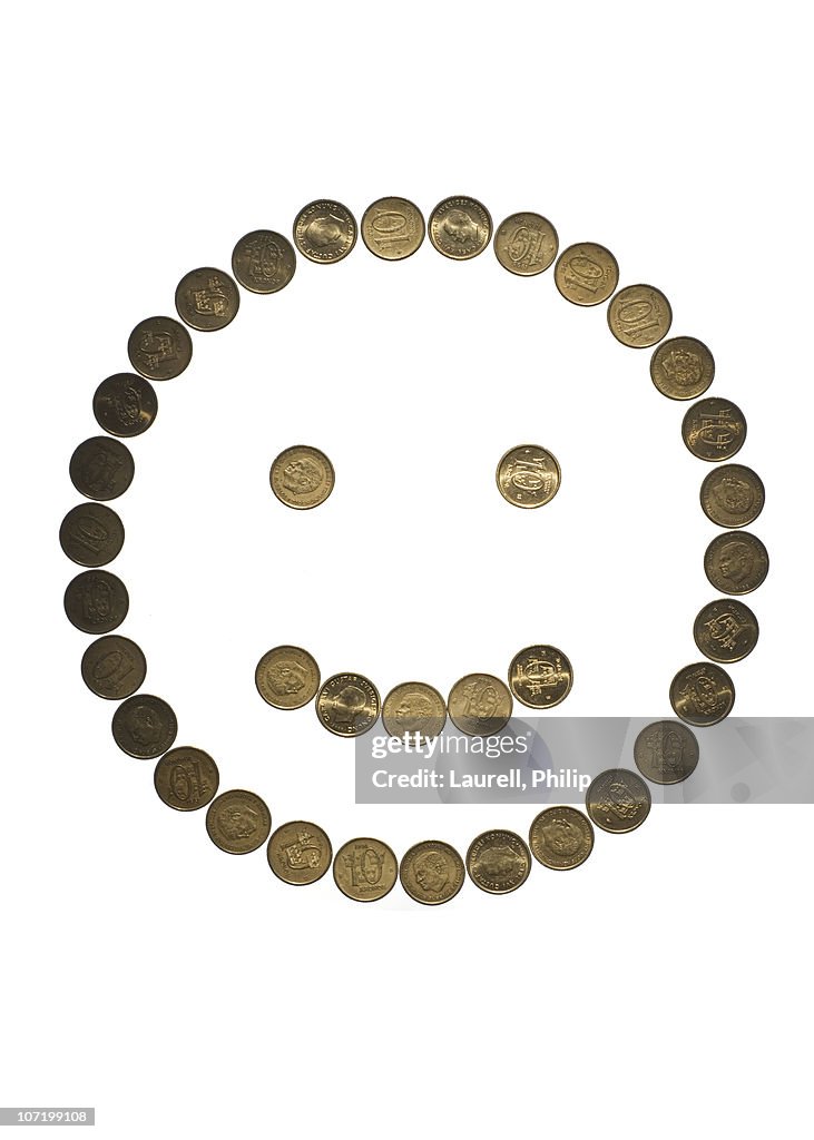 Coins arranged as smiley face