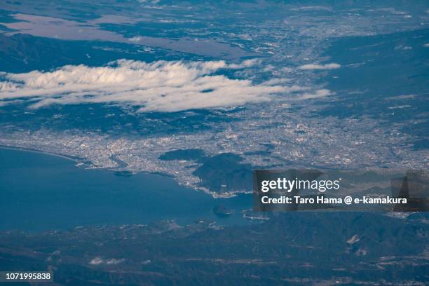 suruga bay, and numazu and mishima cities in shizuoka prefecture in japan daytime aerial view from airplane - suruga bay stock pictures, royalty-free photos & images