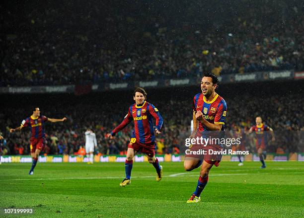 Xavi Hernandez of Barcelona celebrates after scoring the first goal during the La Liga match between Barcelona and Real Madrid at the Camp Nou...