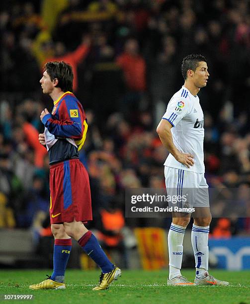 Cristiano Ronaldo of Real Madrid and Lionel Messi of FC Barcelona look on during the La Liga match between Barcelona and Real Madrid at the Camp Nou...