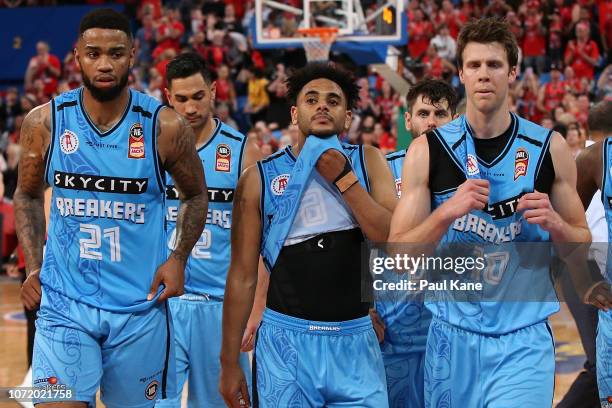 Shawn Long, Corey Webster and Thomas Abercrombie of the Breakers walk from the court after being defeated during the round seven NBL match between...