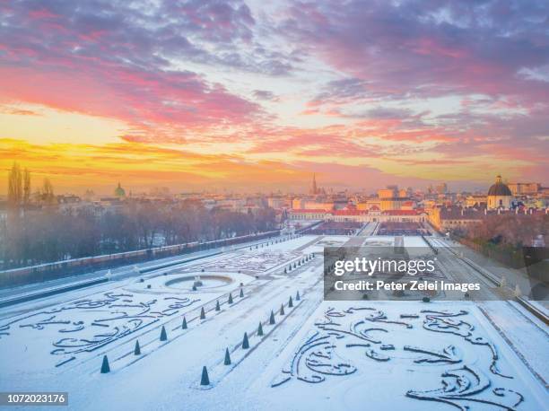 the public belvedere park in the winter, vienna, austria at sunset - vienna austria stock-fotos und bilder