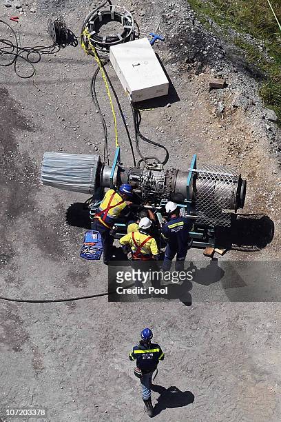 Mine rescue officers work on a machine used to extract gases at the Pike River Mine on November 30, 2010 in Greymouth, New Zealand. Rescue teams have...