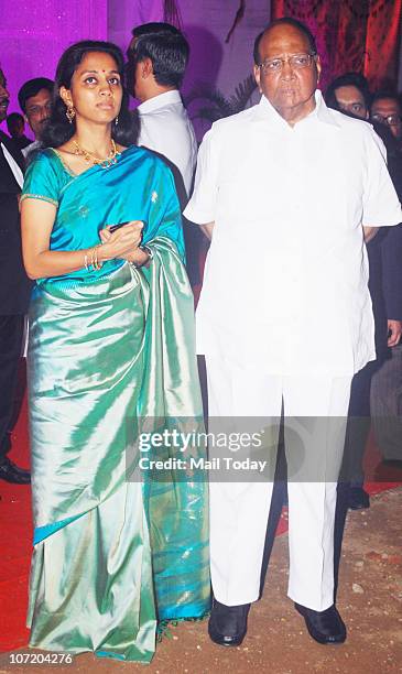 Sharad Pawar with his daughter Supriya Sule during politician Narayan Rane's son's wedding in Mumbai on November 28, 2010.