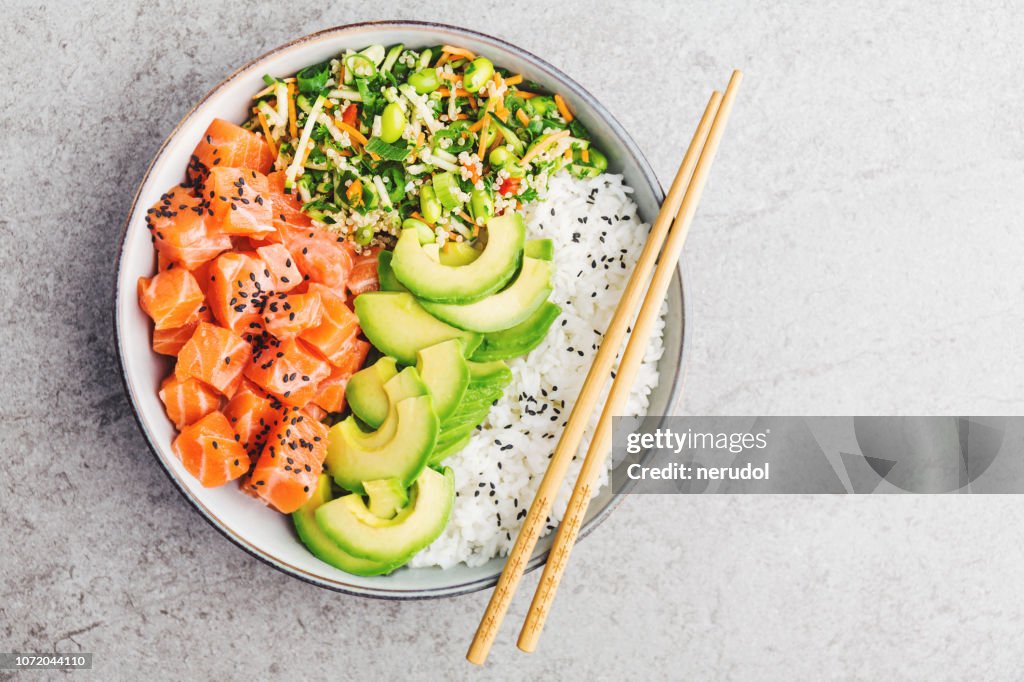 Poke bowl with salmon served in bowl