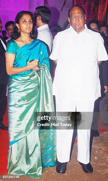 Sharad Pawar with his daughter Supriya Sule during politician Narayan Rane's son's wedding in Mumbai on November 28, 2010.