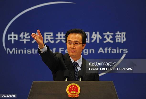 China's Ministry of Foreign Affairs spokesman Hong Lei gestures for questions at a press briefing in Beijing on November 30, 2010. China said it was...