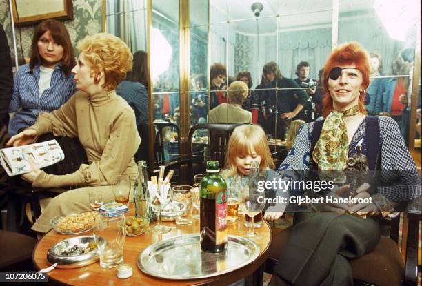 Angie Bowie, Zowie Bowie and David Bowie appear at a press conference at the Amstel Hotel on 7th February 1974 in Amsterdam, Netherlands.