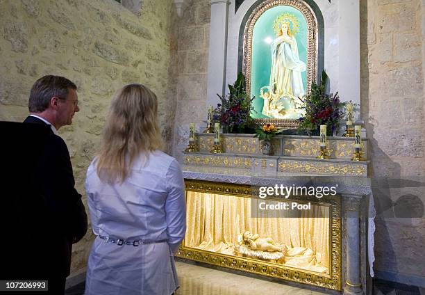 In this photo provided by the German Government Press Office, German President Christian Wulff and his daughter Annalena visit the Chapel of Saint...