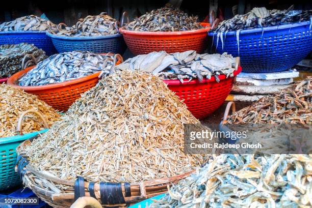 variety of dry fish for sale - cotchin stock-fotos und bilder