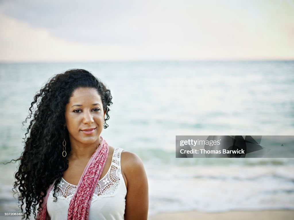 Portrait of woman standing on tropical beach