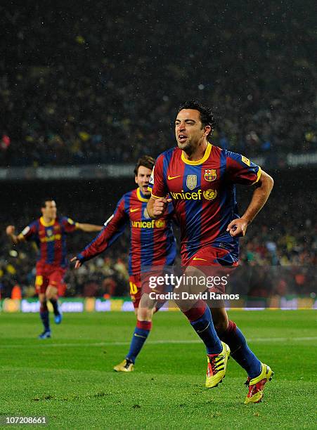 Xavi Hernandez of Barcelona celebrates after scoring the first goal during the La Liga match between Barcelona and Real Madrid at the Camp Nou...