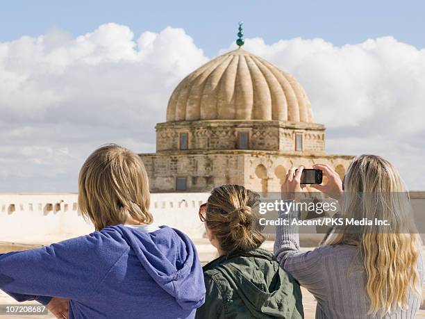 family looks out/takes picture of minarets - tunisia girl stock pictures, royalty-free photos & images