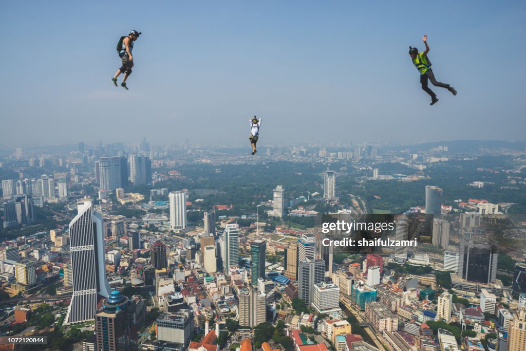 A BASE jumpers in jumps off from KL Tower. KL Tower BASE Jump is an annually event and participants from experienced BASE jumpers from all around the world.