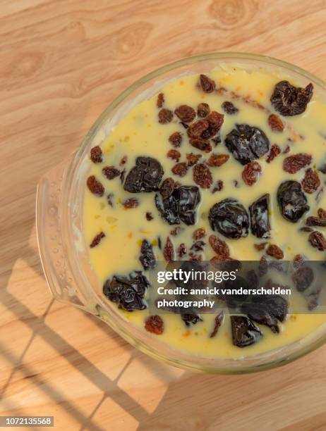 fruity liqueur bread pudding preparation - fruity bread stock pictures, royalty-free photos & images