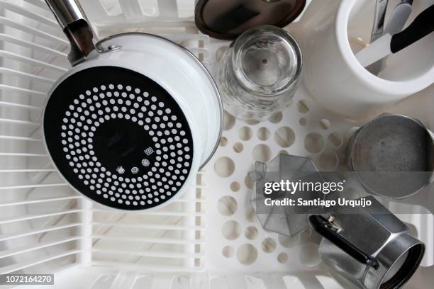 kitchen utensils on a drying rack - bricco per il caffè foto e immagini stock