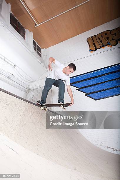 skateboarder on ramp at skate park - skate half pipe stock pictures, royalty-free photos & images