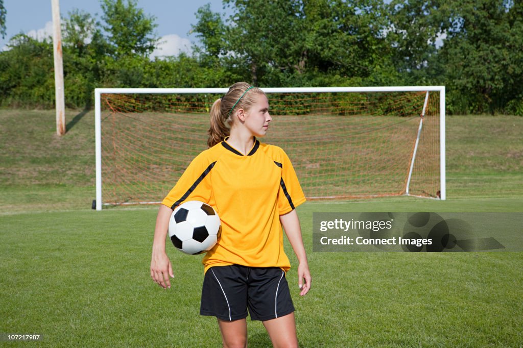 Girl soccer player with ball