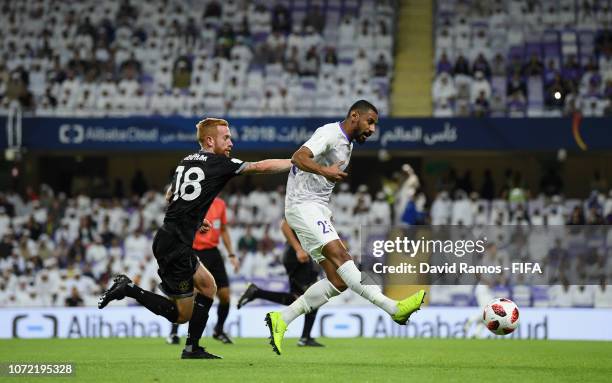 Mohamed Ahmed of Al Ain beats Aaron Clapham of Team Wellington during the FIFA Club World Cup first round play-off match between Al Ain FC and Team...