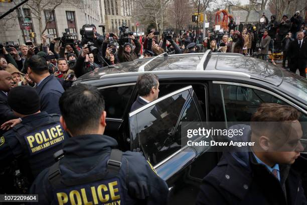 Michael Cohen, President Donald Trump's former personal attorney and fixer, gets into a car as he exits federal court after his sentencing hearing,...