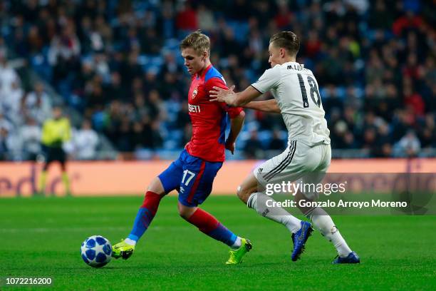 Arnor Sigurdsson of CSKA and Marcos Llorente of Real Madrid in action during the UEFA Champions League Group G match between Real Madrid and CSKA...