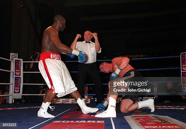 Danny Williams watches Mark Potter as he counted after he is knocked down during his British and Commonwealth Heavyweight Title Bout held at Wembey,...