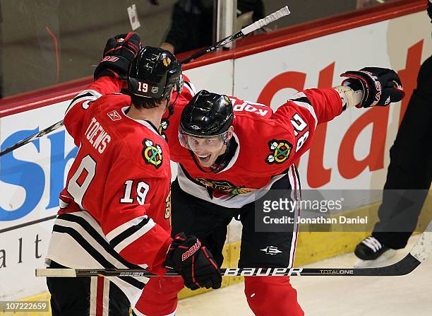 Tomas Kopecky of the Chicago Blackhawks celebrates a goal by teammate Jonathan Toews in the 3rd period against the St. Louis Blues at the United...
