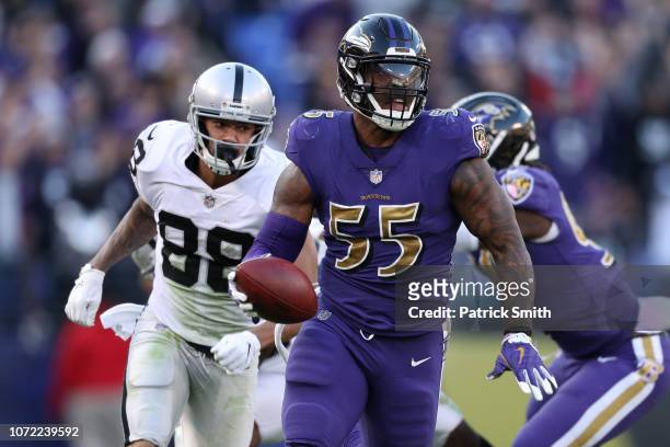Outside Linebacker Terrell Suggs of the Baltimore Ravens runs back a fumble for a touchdown in the fourth quarter against the Oakland Raiders at M&T...