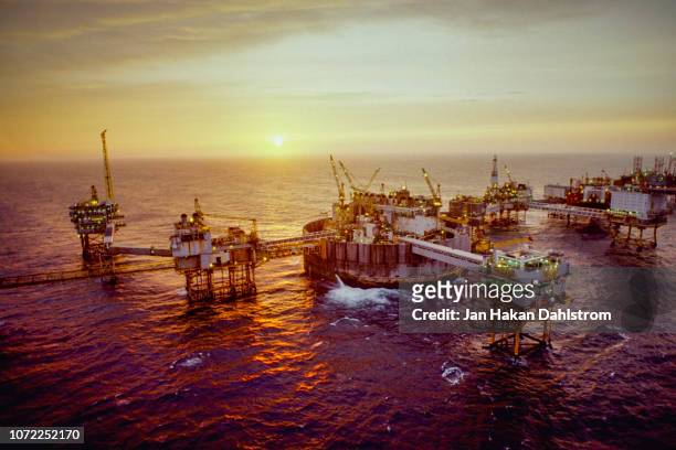 oil production platform in the north sea - oil field stockfoto's en -beelden
