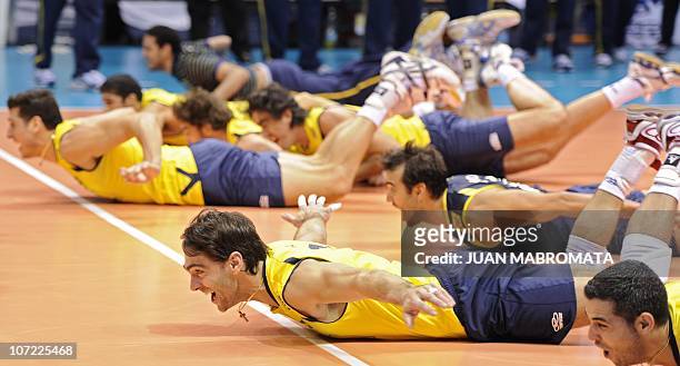 Brazilian captain Giba celebrates with teammates after defeating Russia in the World League 2010 final volleyball match at Orfeo Superdomo stadium in...