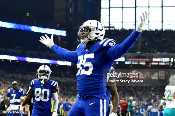Eric Ebron of the Indianapolis Colts celebrates after scoring a touchdown in the game against Miami Dolphins in the first quarter at Lucas Oil...