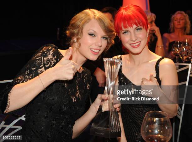 Honoree Taylor Swift and Recording Artists Hayley Williams of the group Paramore and Kid Rock at the CMT Artists of the Year at The Factory on...